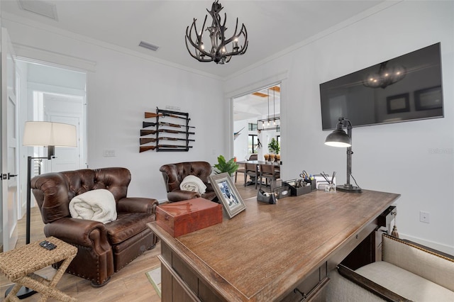 interior space with a notable chandelier, visible vents, ornamental molding, and light wood-style floors