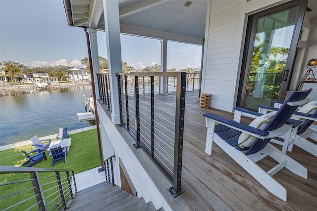 exterior space featuring a yard and a water view