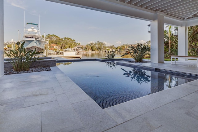 outdoor pool featuring a patio area