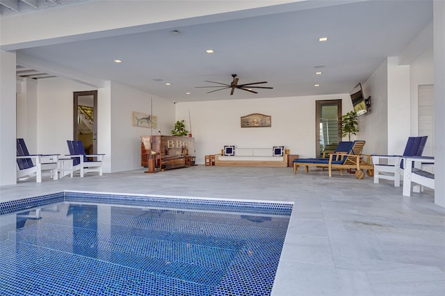 view of swimming pool featuring ceiling fan
