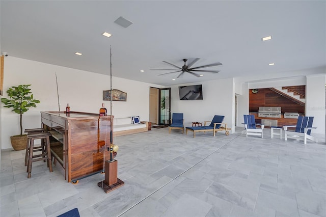 bar with a ceiling fan and recessed lighting