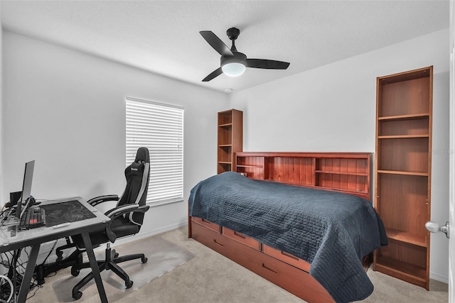 bedroom featuring carpet floors, a ceiling fan, and baseboards
