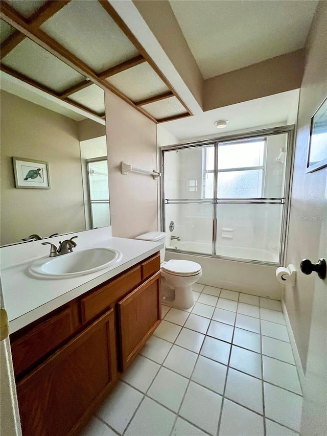 114 Clays Trl Unit 114, Oldsmar, FL 34677 - full bathroom with tile patterned flooring, toilet, vanity, and bath / shower combo with glass door