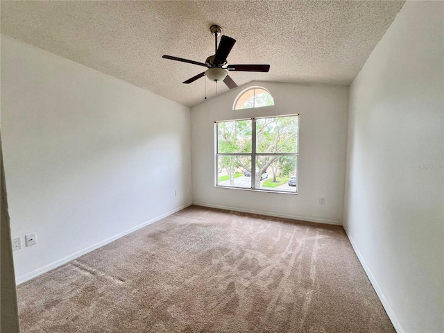 114 Clays Trl Unit 114, Oldsmar, FL 34677 - unfurnished room featuring light carpet, vaulted ceiling, a ceiling fan, a textured ceiling, and baseboards
