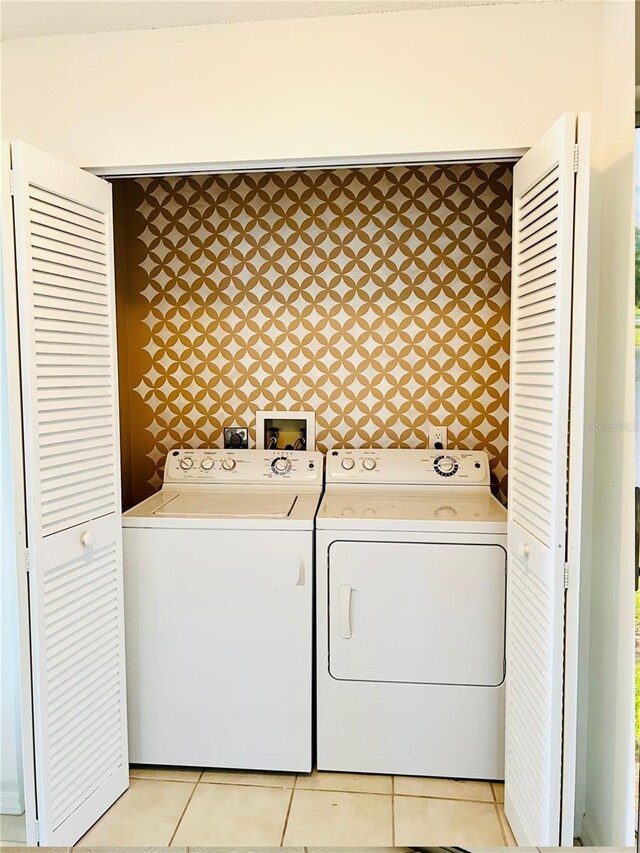 114 Clays Trl Unit 114, Oldsmar, FL 34677 - washroom with washer and dryer and light tile patterned floors