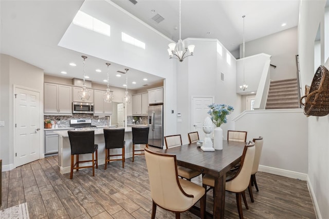 17537 Brighton Lake Rd, Land O Lakes, FL 34638 - dining space featuring baseboards, wood finished floors, and stairway