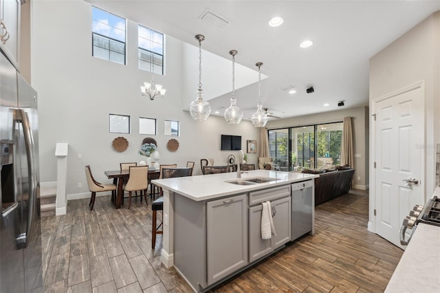 17537 Brighton Lake Rd, Land O Lakes, FL 34638 - kitchen with a sink, stainless steel appliances, open floor plan, visible vents, and dark wood-style floors