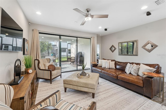 17537 Brighton Lake Rd, Land O Lakes, FL 34638 - living room with a ceiling fan, visible vents, and recessed lighting