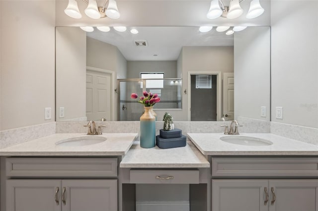 17537 Brighton Lake Rd, Land O Lakes, FL 34638 - bathroom featuring an inviting chandelier, vanity, a stall shower, and visible vents