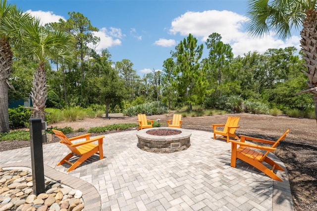 17537 Brighton Lake Rd, Land O Lakes, FL 34638 - view of patio / terrace with an outdoor fire pit