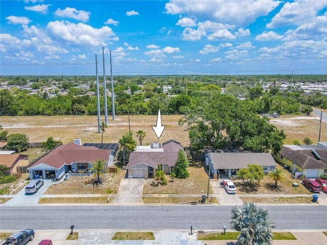 birds eye view of property with a residential view
