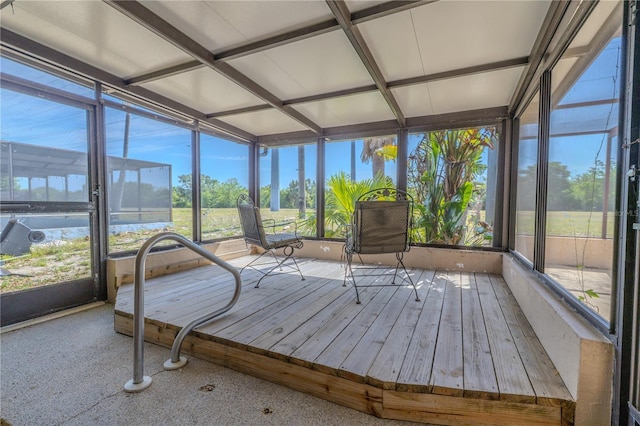 sunroom / solarium featuring coffered ceiling and a wealth of natural light