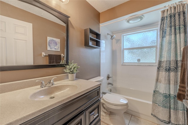 full bath featuring vanity, toilet, tile patterned floors, a textured ceiling, and shower / bath combo with shower curtain