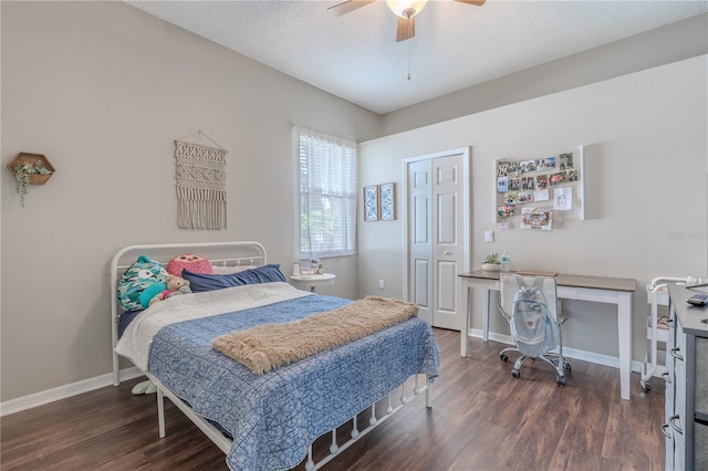 bedroom with a textured ceiling, a ceiling fan, baseboards, wood finished floors, and a closet