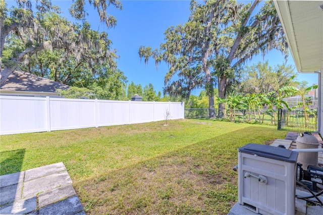 view of yard with a fenced backyard