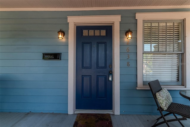 entrance to property with covered porch