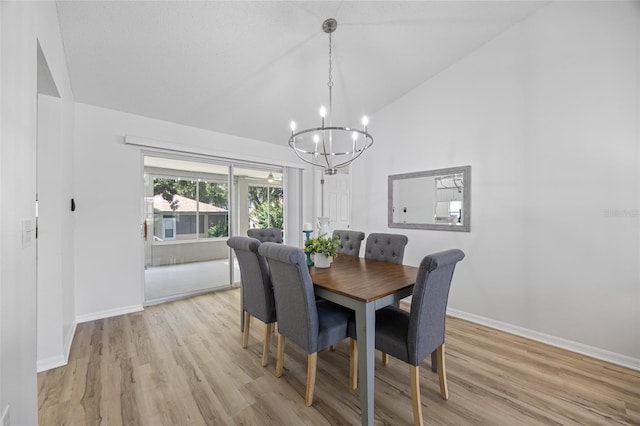 11218 Sun Tree Rd, Hudson, FL 34667 - dining space with a chandelier, vaulted ceiling, and light wood-type flooring