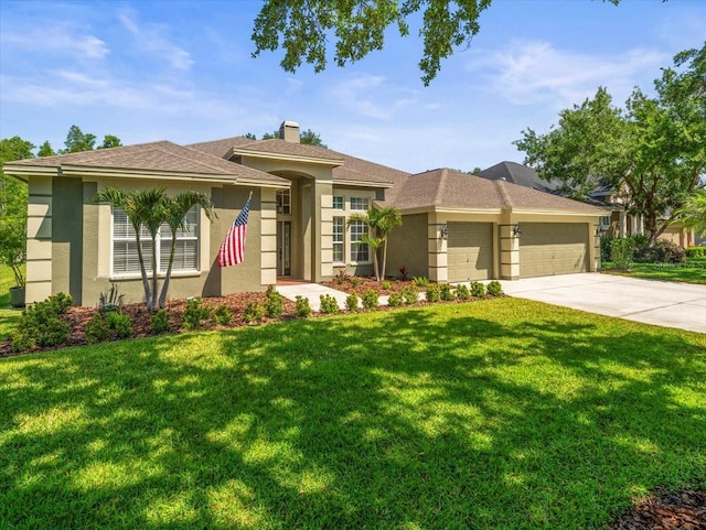 view of front of house with driveway, a chimney, a front yard, an attached garage, and stucco siding