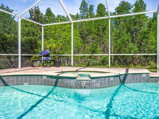 view of swimming pool with glass enclosure and a pool with connected hot tub