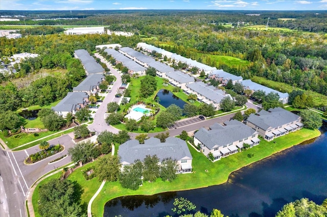 26514 Chimney Spire Ln, Wesley Chapel, FL 33544 - aerial view of property's location with nearby suburban area, a large body of water, and a heavily wooded area