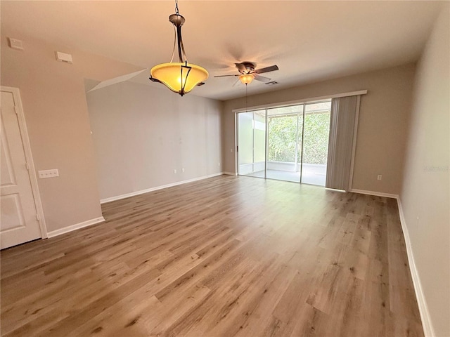 26514 Chimney Spire Ln, Wesley Chapel, FL 33544 - unfurnished room with baseboards, wood finished floors, and ceiling fan