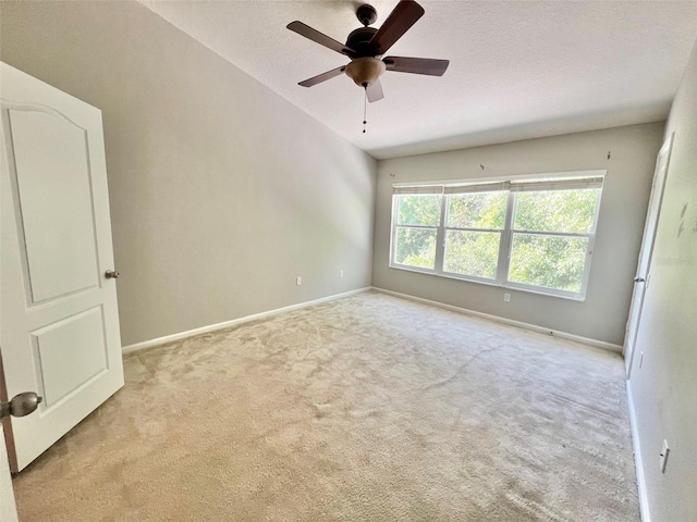 26514 Chimney Spire Ln, Wesley Chapel, FL 33544 - unfurnished room with carpet flooring, baseboards, ceiling fan, a textured ceiling, and vaulted ceiling