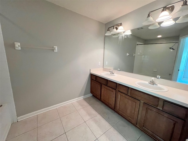 26514 Chimney Spire Ln, Wesley Chapel, FL 33544 - full bath with tile patterned flooring, double vanity, and baseboards