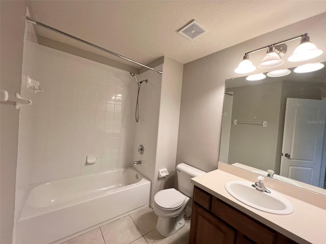 26514 Chimney Spire Ln, Wesley Chapel, FL 33544 - bathroom with tile patterned flooring, toilet, vanity, and shower / washtub combination