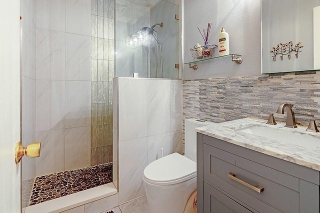 bathroom with walk in shower, tile walls, toilet, and vanity