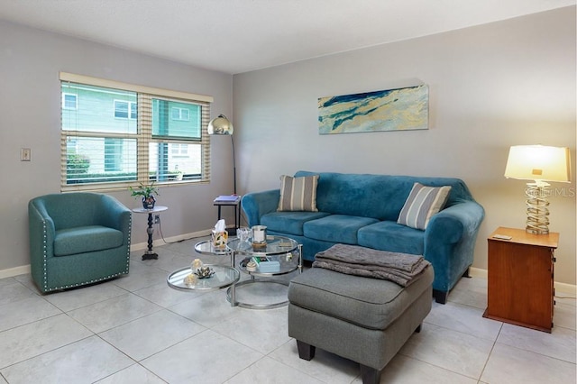 living area with light tile patterned floors and baseboards