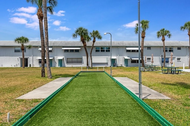 view of home's community featuring a residential view and a yard