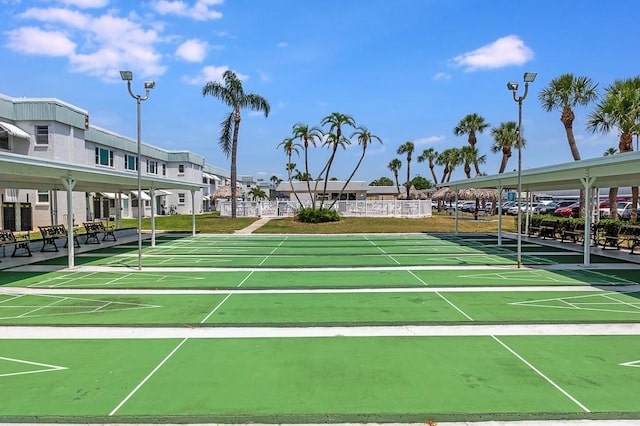 view of property's community featuring shuffleboard