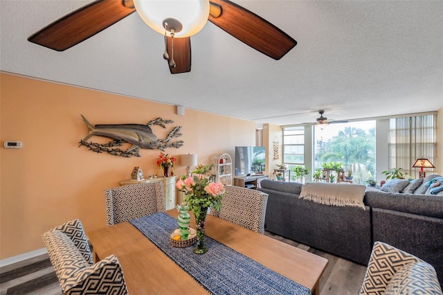 7400 Sun Island Dr S Unit 206, South Pasadena, FL 33707 - dining space featuring a ceiling fan and wood finished floors