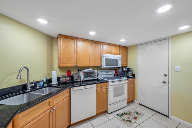 7400 Sun Island Dr S Unit 206, South Pasadena, FL 33707 - kitchen featuring white appliances, a sink, dark stone counters, recessed lighting, and light tile patterned floors