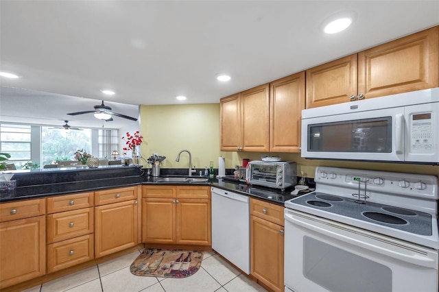 7400 Sun Island Dr S Unit 206, South Pasadena, FL 33707 - kitchen featuring white appliances, a sink, light tile patterned floors, dark stone countertops, and a ceiling fan