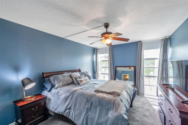 7400 Sun Island Dr S Unit 206, South Pasadena, FL 33707 - bedroom with carpet floors, a ceiling fan, and a textured ceiling