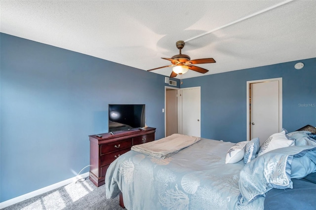 7400 Sun Island Dr S Unit 206, South Pasadena, FL 33707 - carpeted bedroom featuring baseboards, ceiling fan, and a textured ceiling