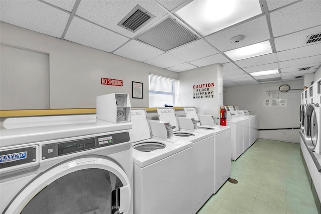 7400 Sun Island Dr S Unit 206, South Pasadena, FL 33707 - shared laundry room with washer and clothes dryer and light floors