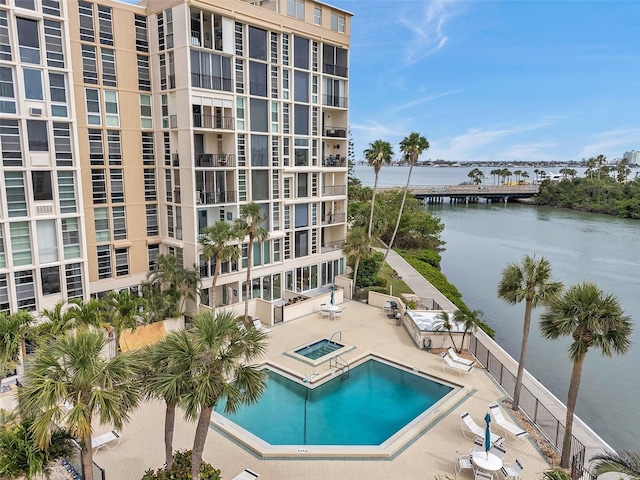 7400 Sun Island Dr S Unit 206, South Pasadena, FL 33707 - community pool featuring a community hot tub, a water view, a patio, and fence