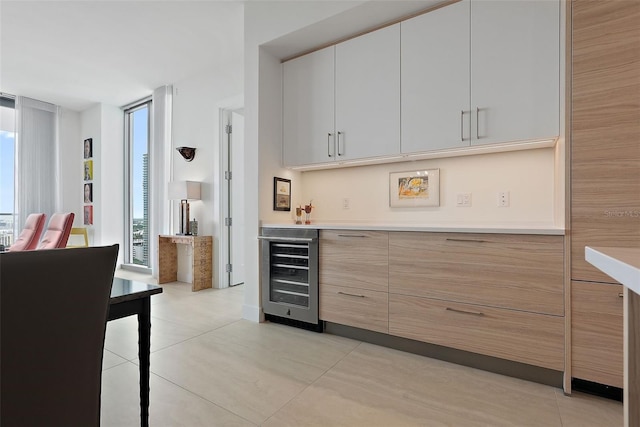 301 1st St S Unit 2305, Saint Petersburg, FL 33701 - bar with light tile patterned floors, a dry bar, and beverage cooler