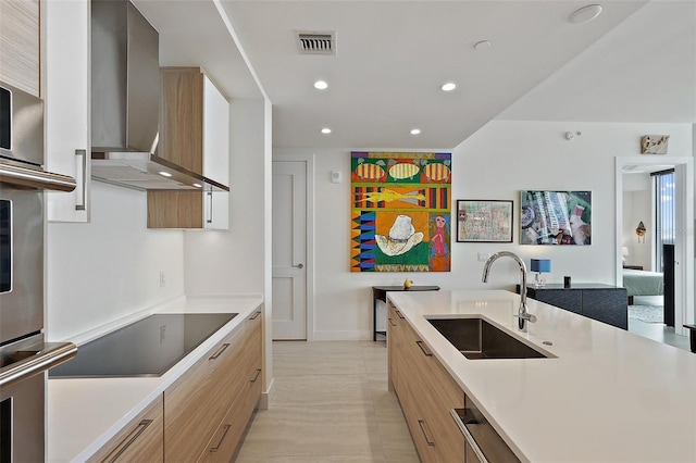 301 1st St S Unit 2305, Saint Petersburg, FL 33701 - kitchen with visible vents, wall chimney exhaust hood, modern cabinets, and a sink