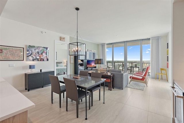 301 1st St S Unit 2305, Saint Petersburg, FL 33701 - dining space with floor to ceiling windows, a chandelier, and light tile patterned flooring
