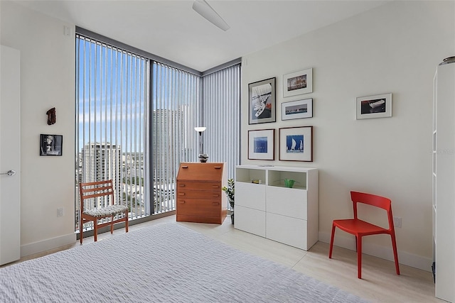 301 1st St S Unit 2305, Saint Petersburg, FL 33701 - bedroom featuring floor to ceiling windows and baseboards