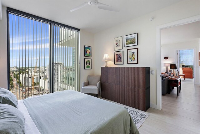 301 1st St S Unit 2305, Saint Petersburg, FL 33701 - bedroom featuring access to exterior, a ceiling fan, and baseboards