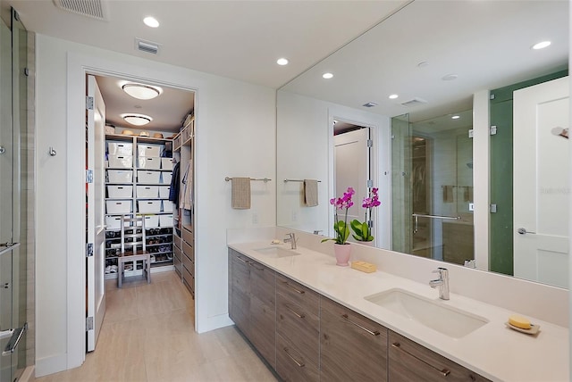 301 1st St S Unit 2305, Saint Petersburg, FL 33701 - bathroom featuring a stall shower, a sink, and visible vents