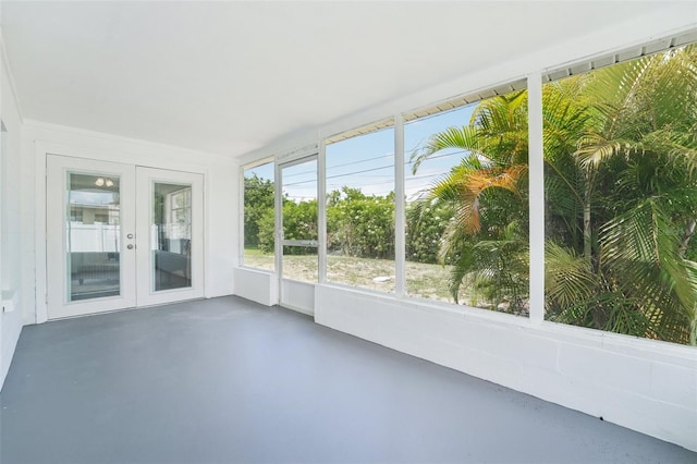 unfurnished sunroom featuring french doors