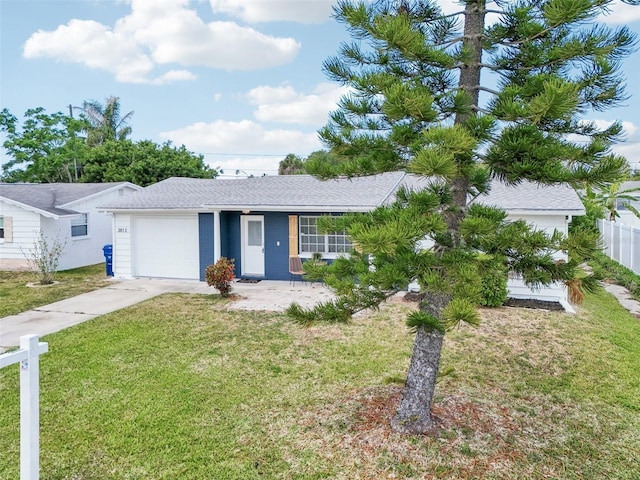 ranch-style house featuring concrete driveway, an attached garage, fence, and a front lawn