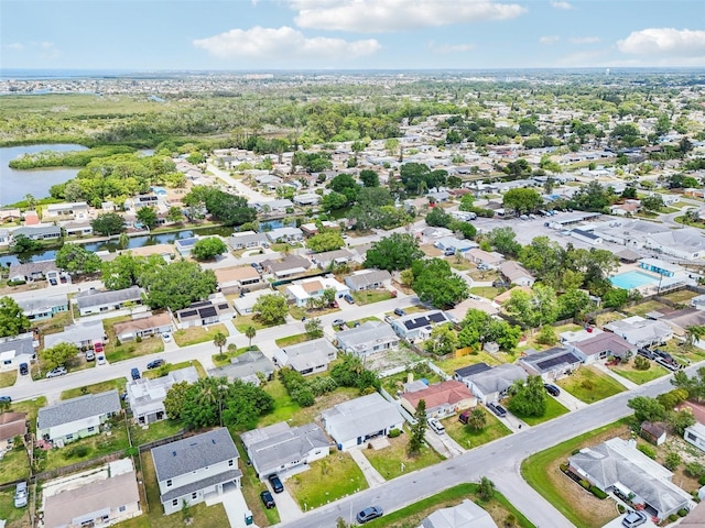 birds eye view of property featuring a water view and a residential view