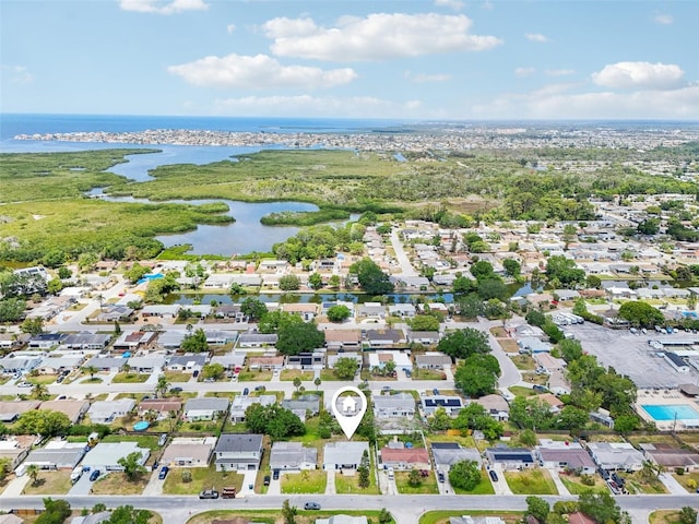 birds eye view of property with a water view and a residential view