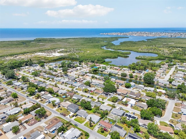 bird's eye view with a water view and a residential view